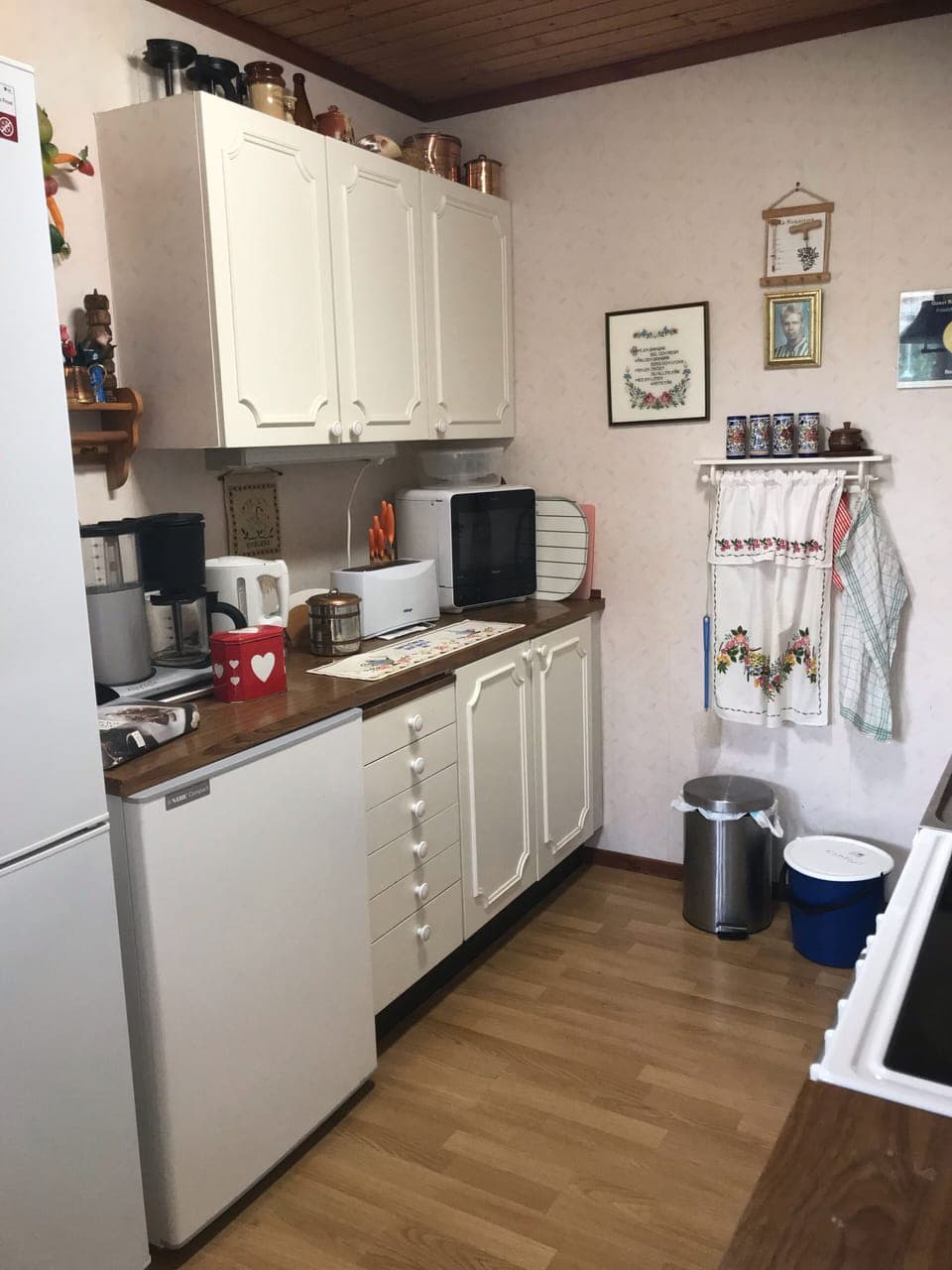 Kitchen with freezer, fridge, coffee machine, water boiler, toaster, microwave 