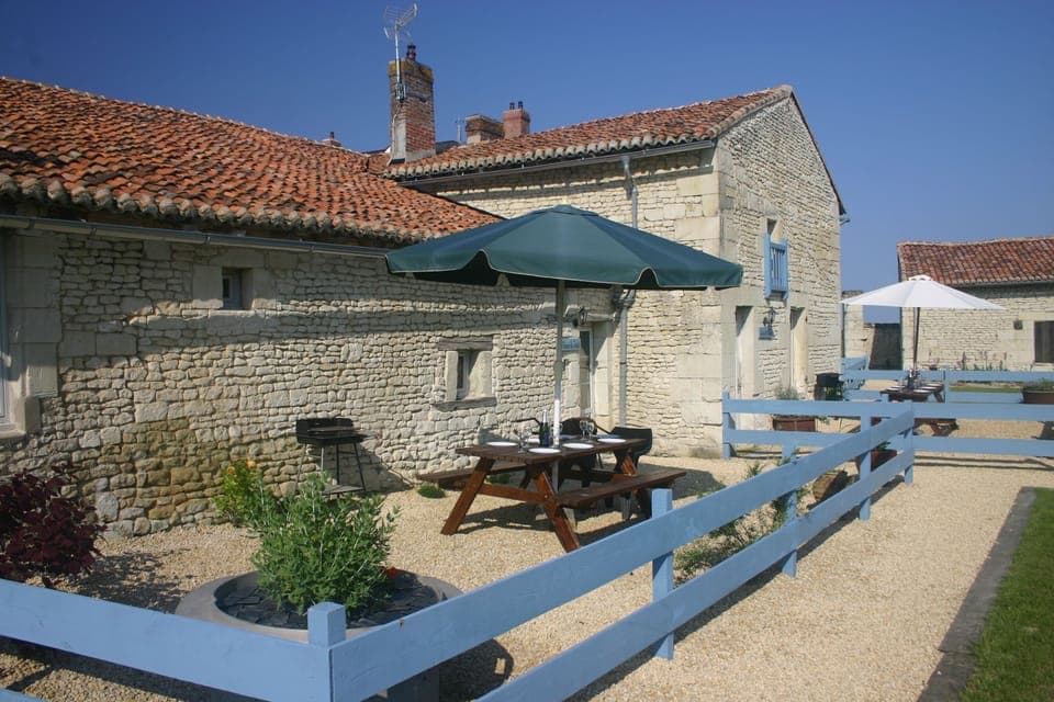 Front view of La Maison du Puits and La Vieille Maison with private terraces
