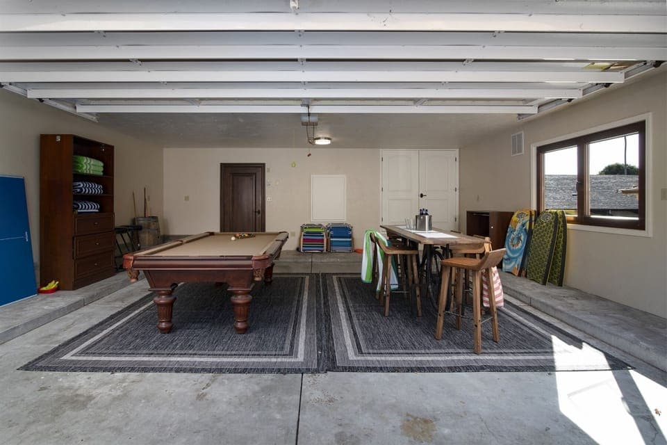 The Garage Game Room includes a pool table with convertible ping pong table top and a dining set to seat 8
