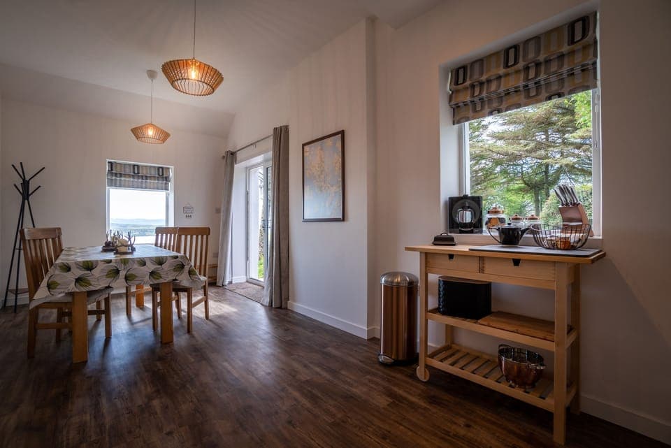 Large Kitchen diner with doors leading into garden