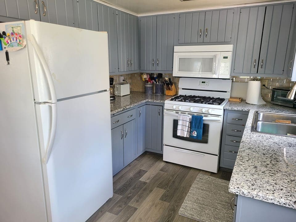 Newly renovated kitchen.  Coffee maker, toaster, gas oven, toaster oven
