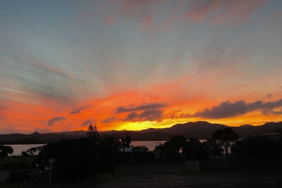 Sunset from front deck over Whangateau Inlet, taken from front deck