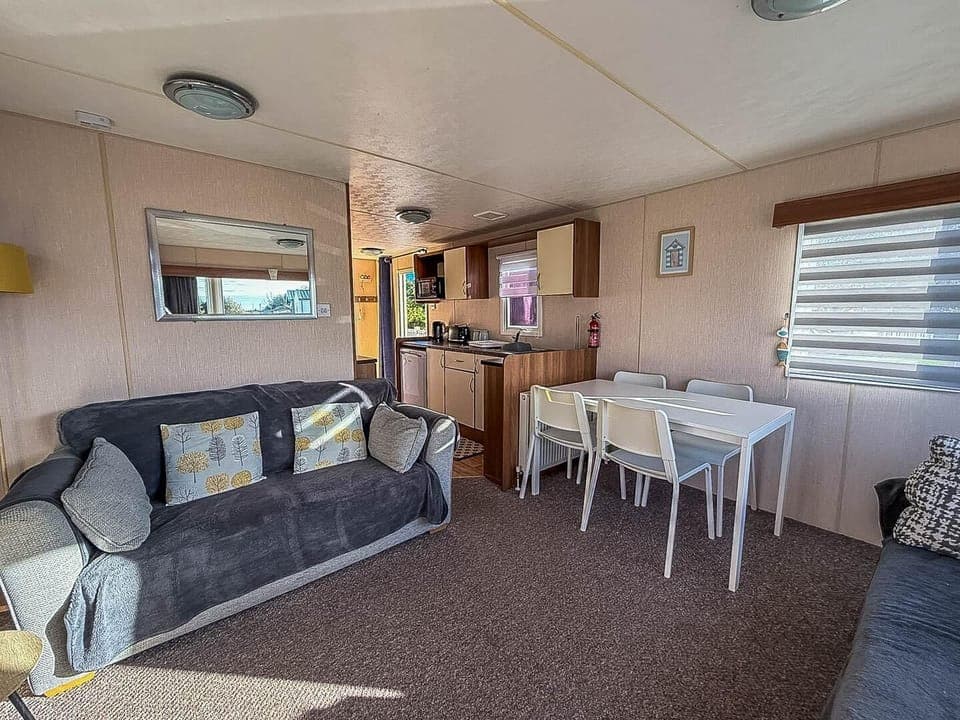 Cozy living and dining area with bright, airy comfort