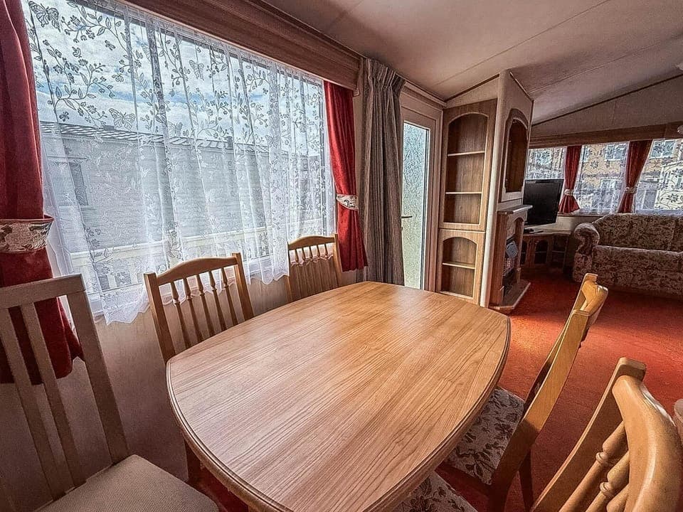 Cozy dining area with warm natural light and classic charm