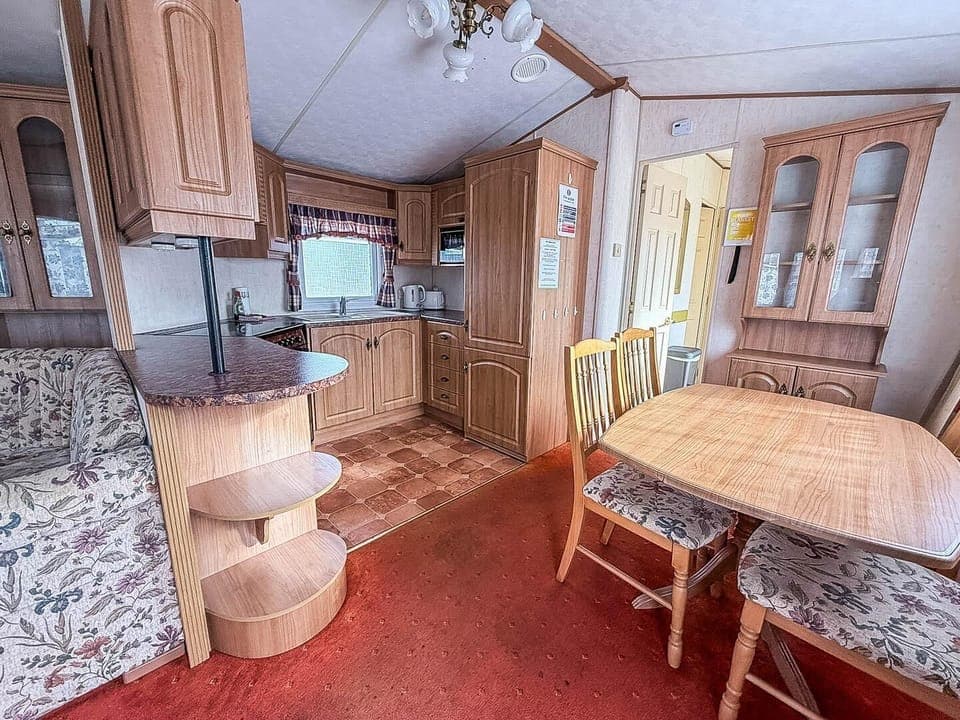 Cozy kitchen and dining area with warm wood accents