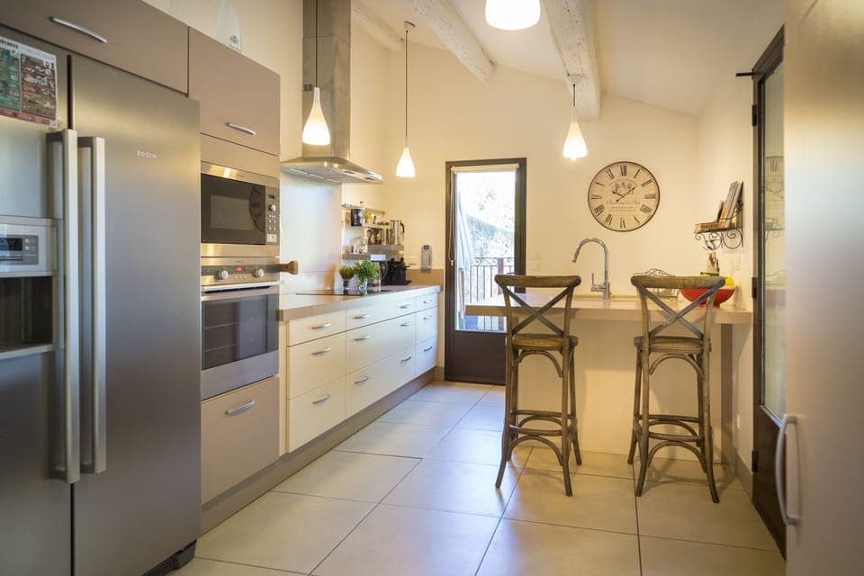 Kitchen with doors to pool and patio.