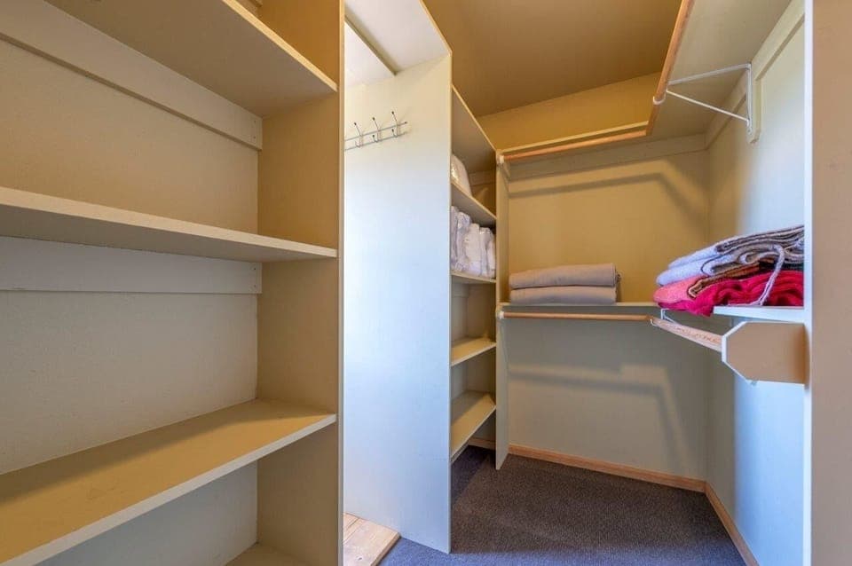 Primary bedroom walk-in closet