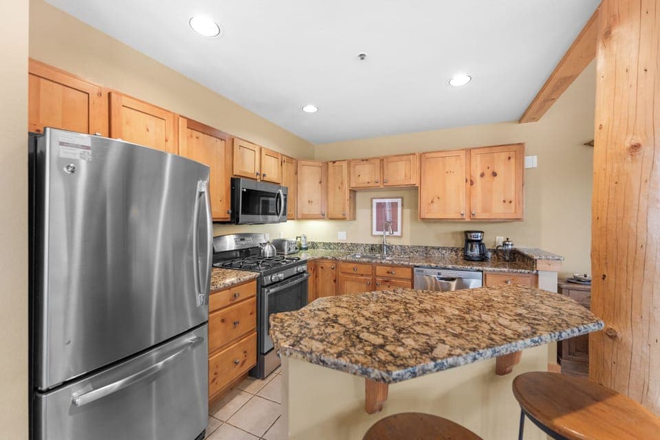 Full kitchen with stainless steel appliances