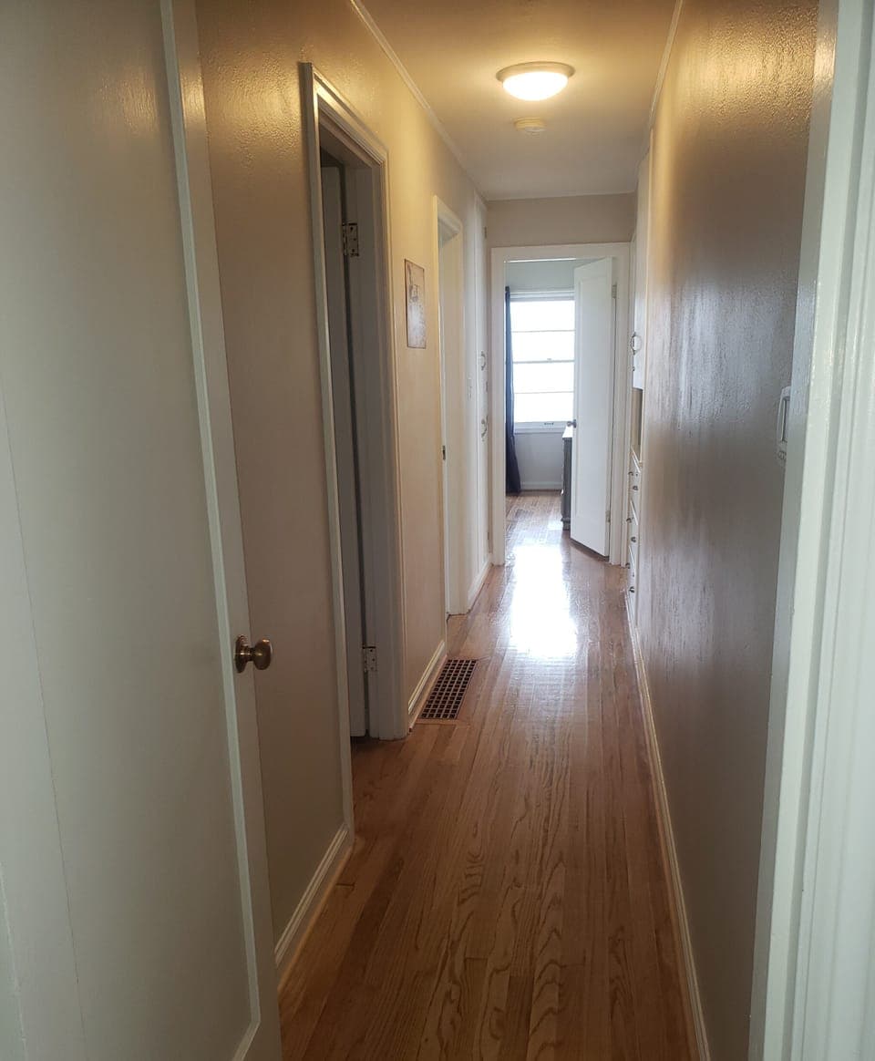 Bedrooms in an isolated hallway off the back of house