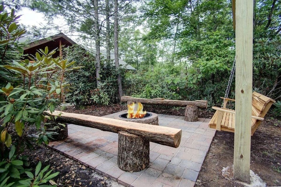 Outdoor fire pit with swing.