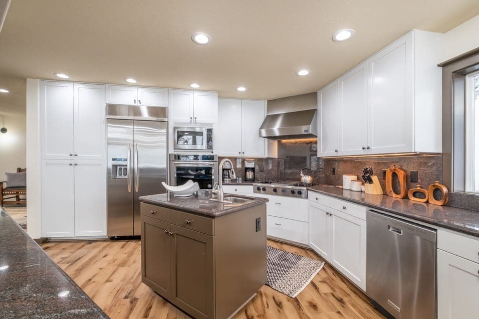 Remodeled kitchen with stainless steel appliances and granite countertops 