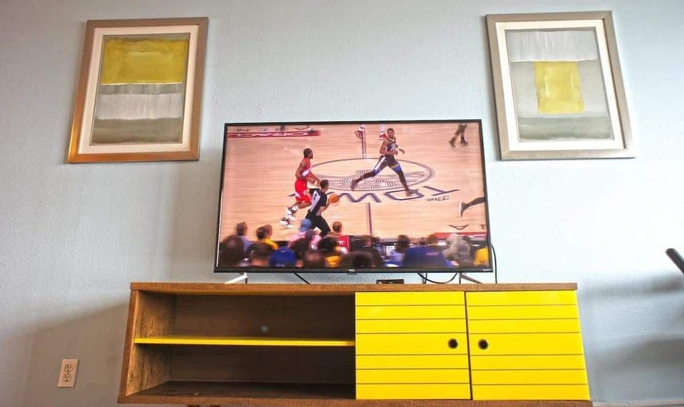 The condo has two 55-inch TVs