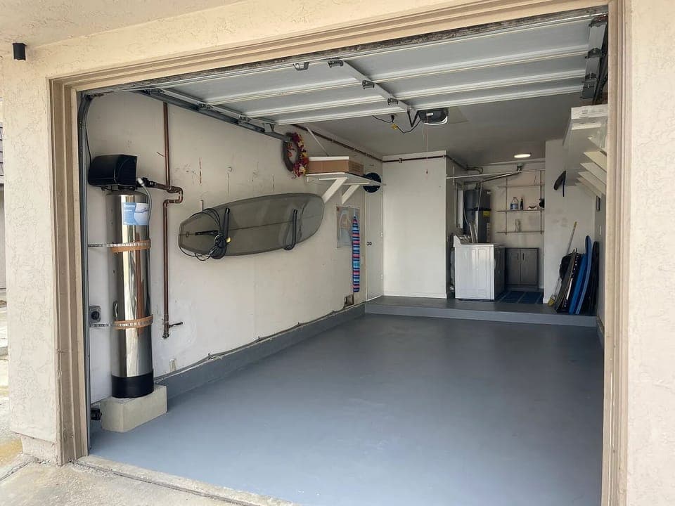 Private attached garage, another private spot in front, and visitor parking