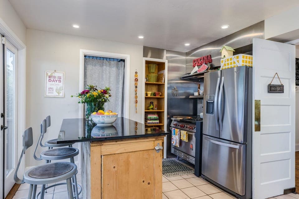Granite top breakfast counter that sits 3.