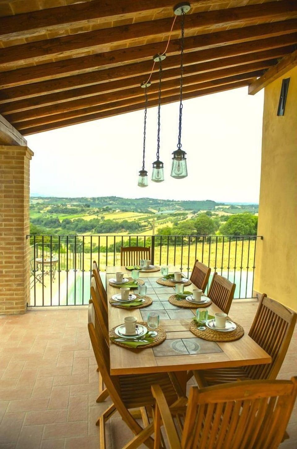 Patio dining area overlooking pool