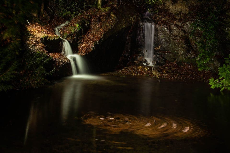 Floodlit 5 metre waterfalls at night