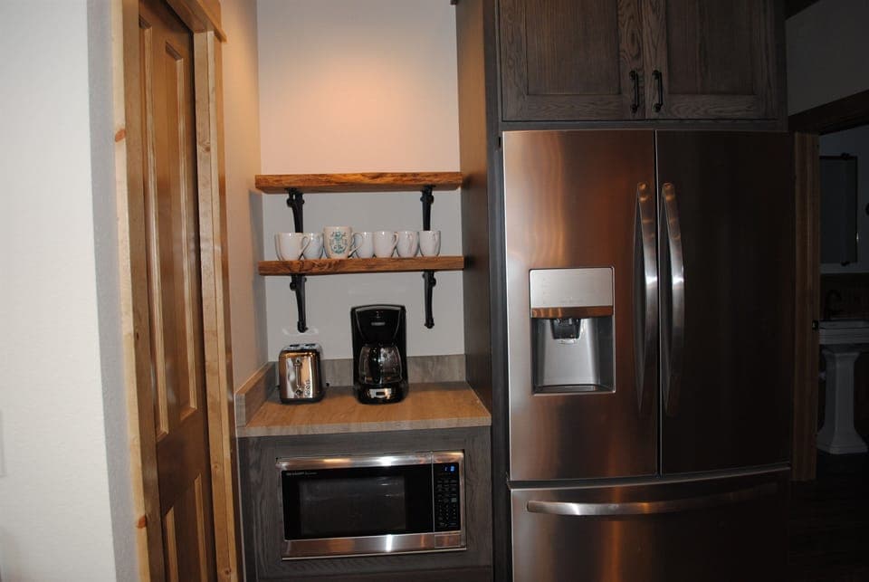 full sized fridge and coffee bar