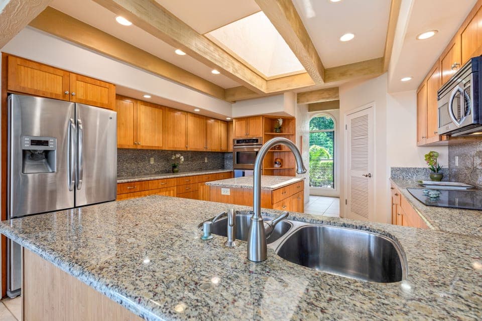 Main kitchen is large with skylight and island with even a double oven.