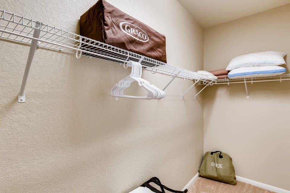 Large walk in Master Closet stocked with queen air mattress, pack n play,pillows