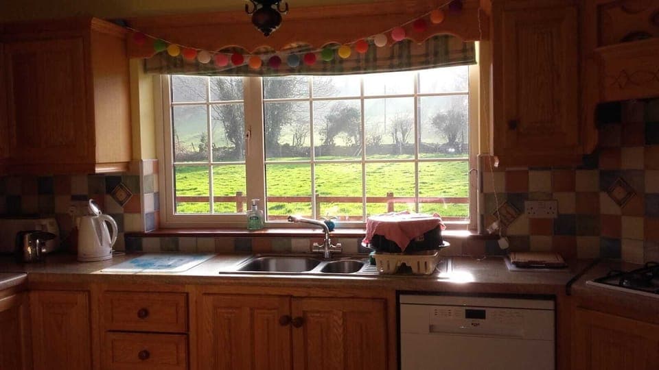 Kitchen overlooks the large back field 