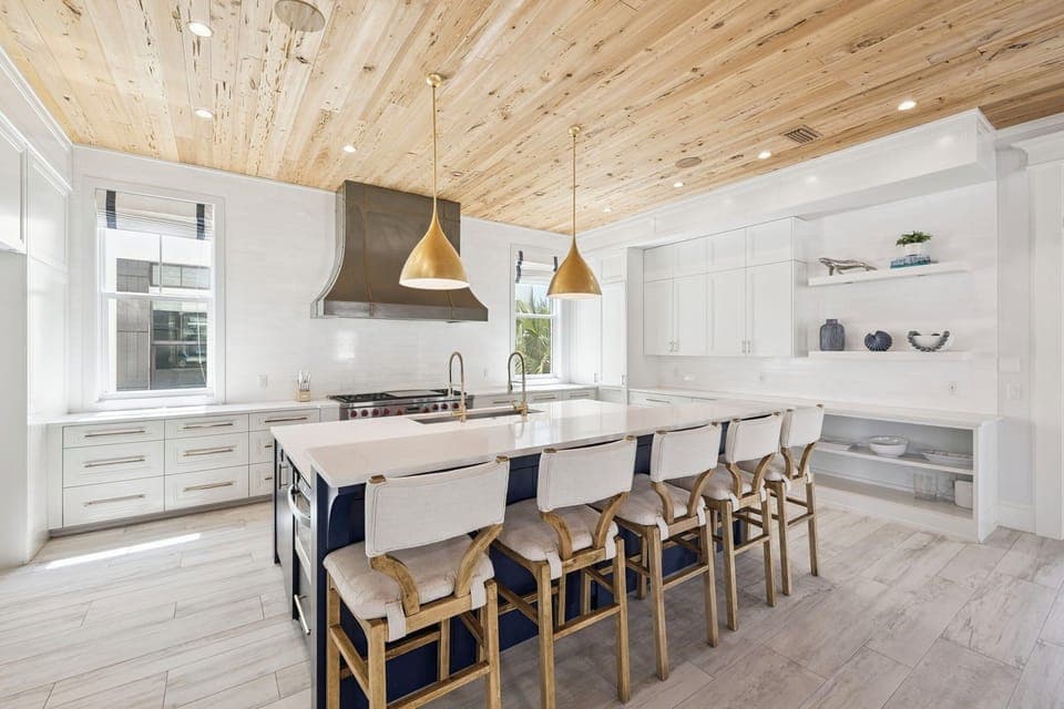 Your dream kitchen awaits with stunning wood ceilings, gleaming counters, and a spacious island perfect for cooking together and creating memories.