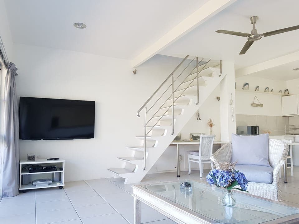 Open - plan lounge with 60'' TV  (full DSTV bouquet)