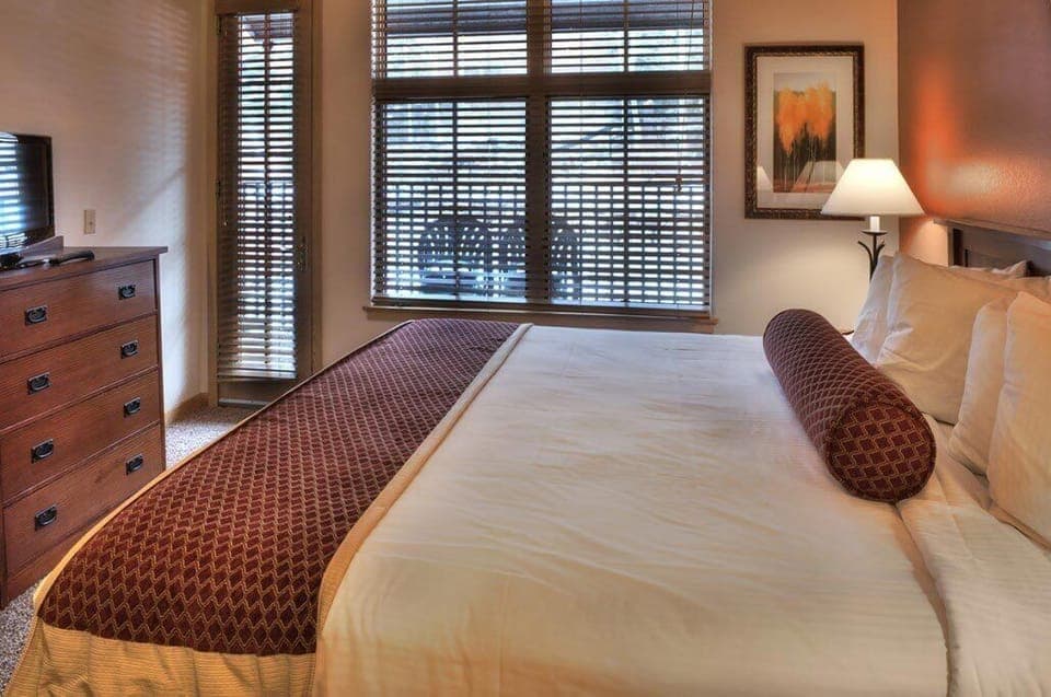 King size bed and plenty of room in private bedroom.  Door out to Deck area.