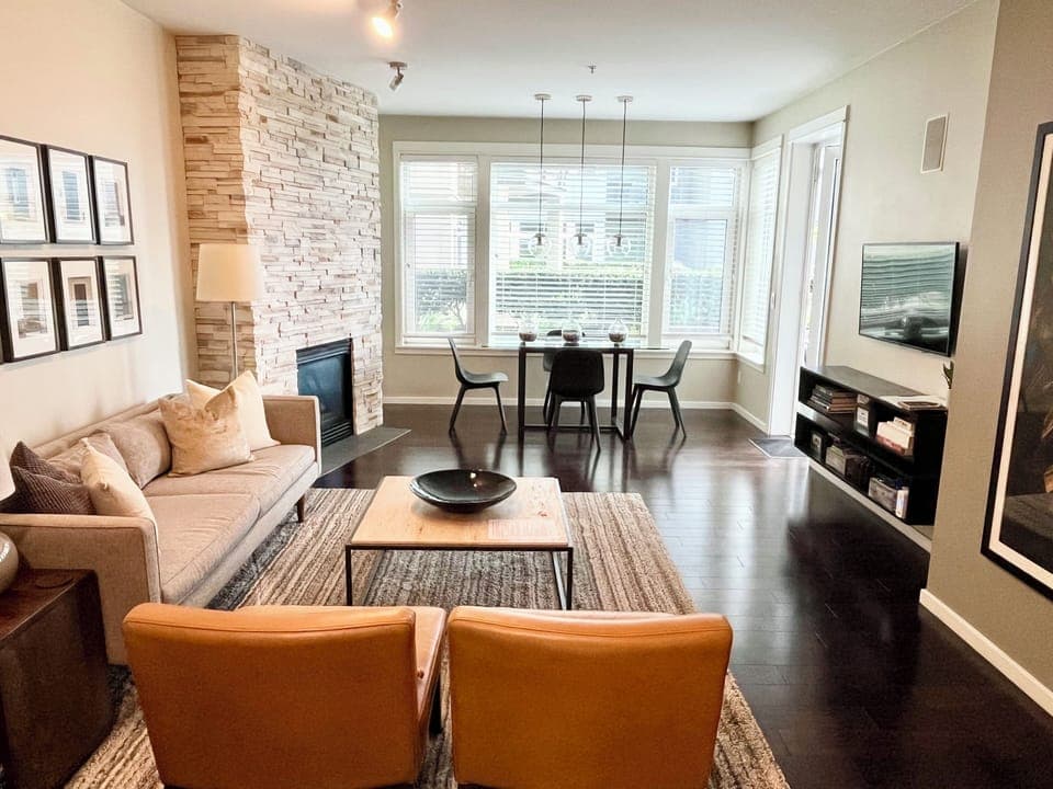 Open living space w/ high ceilings and oversize windows.