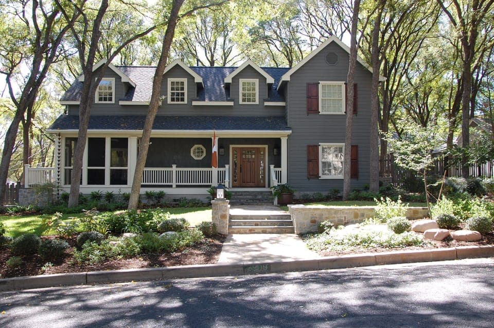 View of our home from the street.  Screened porch located on left side of home.
