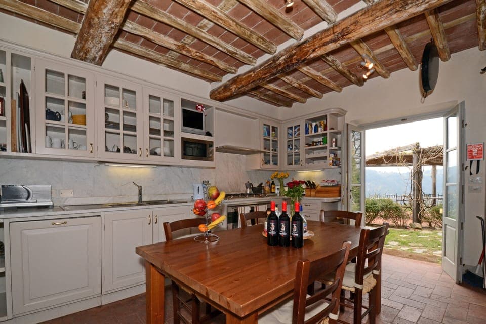 The Kitchen opens onto the Lower Terrace and its pergola'd dining tables