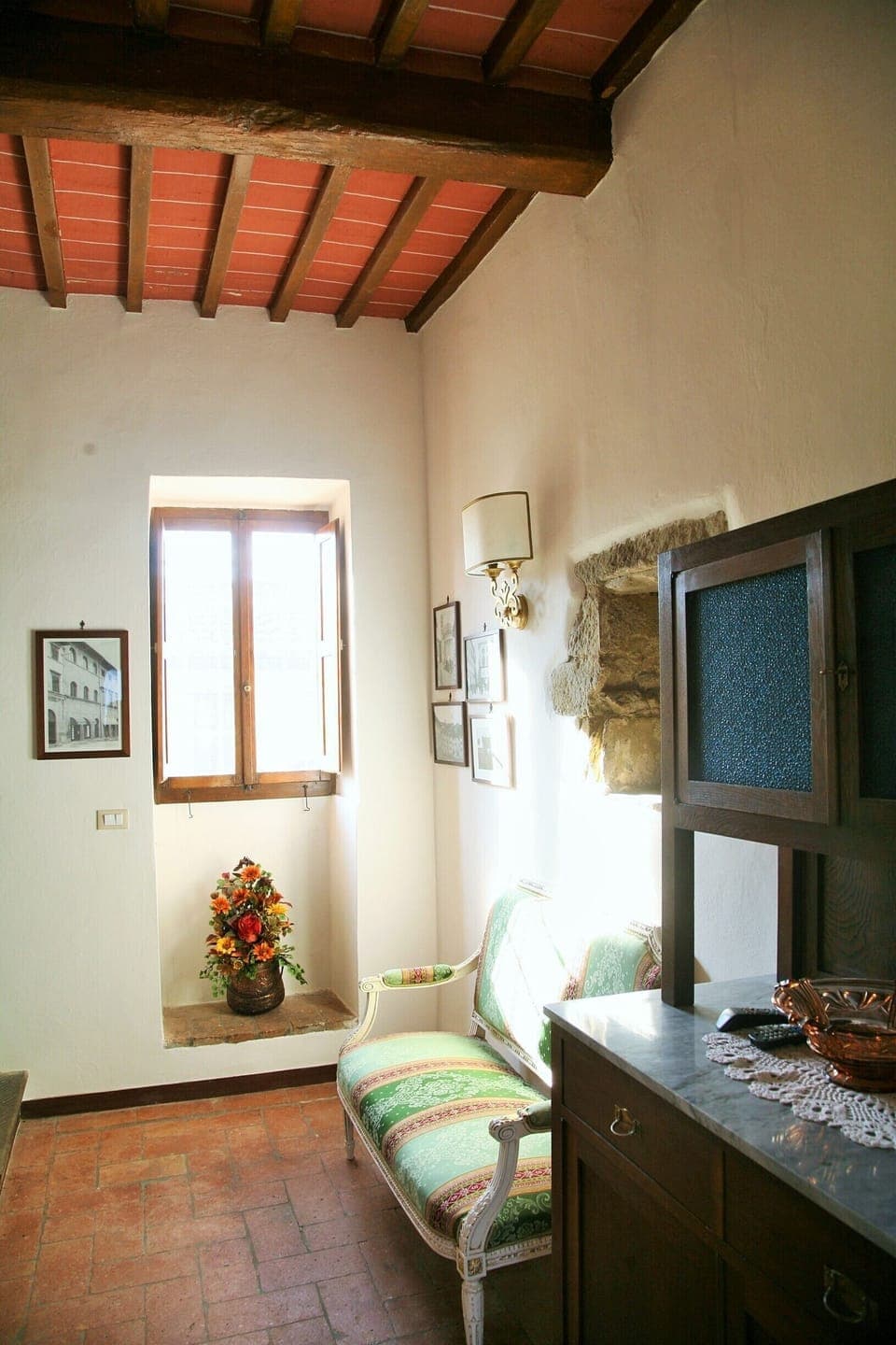The sofa and traditional dresser in the kitchen-livingroom