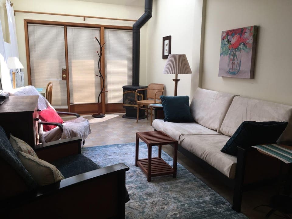 Lots of light! French doors, skylights and private, natural setting and parking!