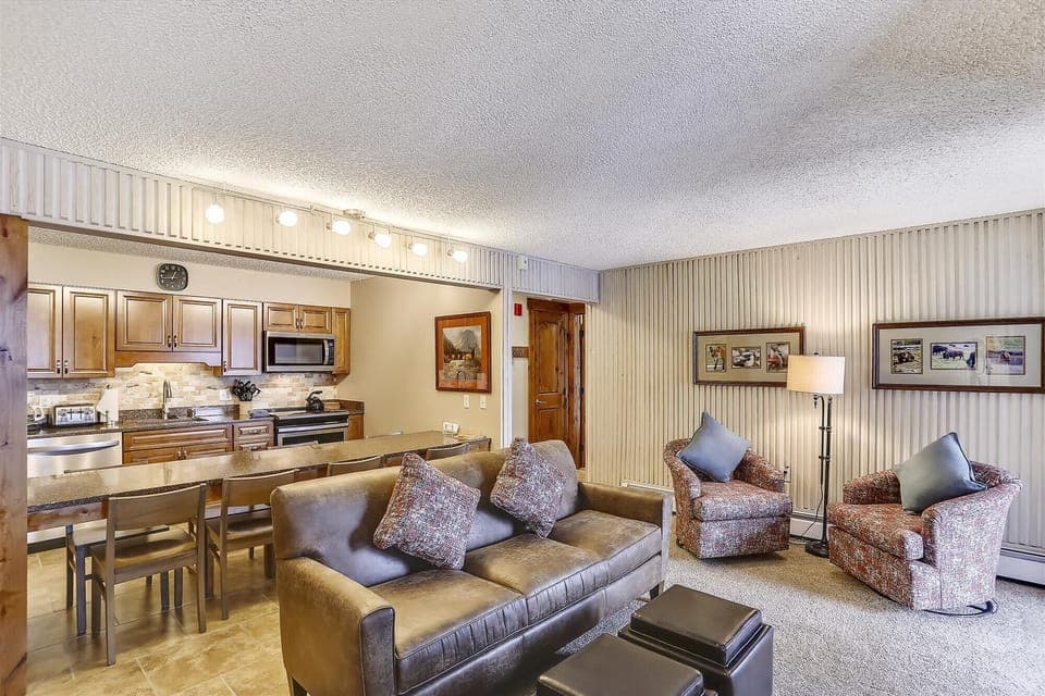 Living Room - Open concept kitchen / living room with views of the slopes and a cozy gas fireplace