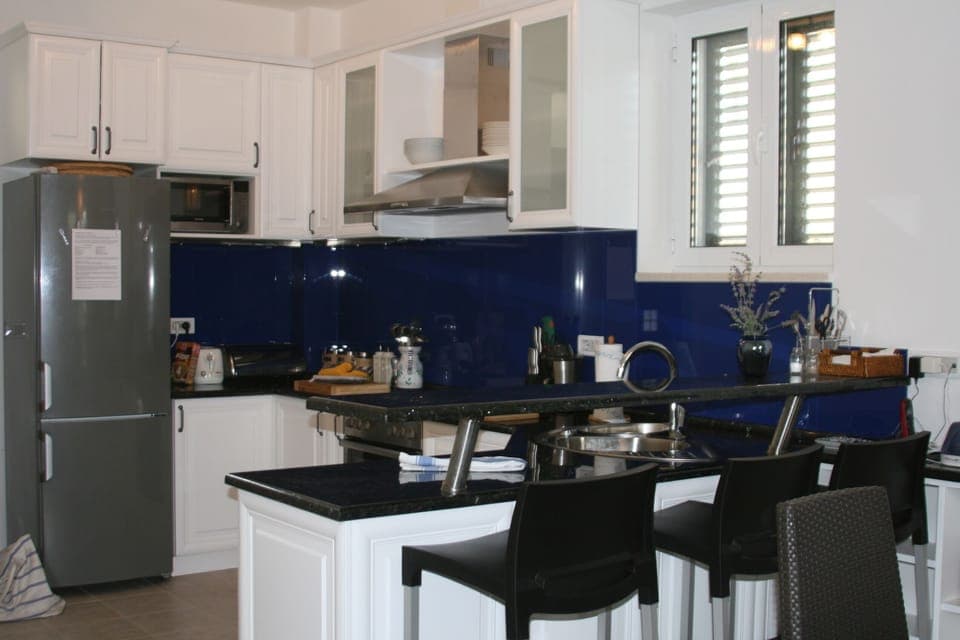 eat-in kitchen with dining table for 4 and 3 barstools