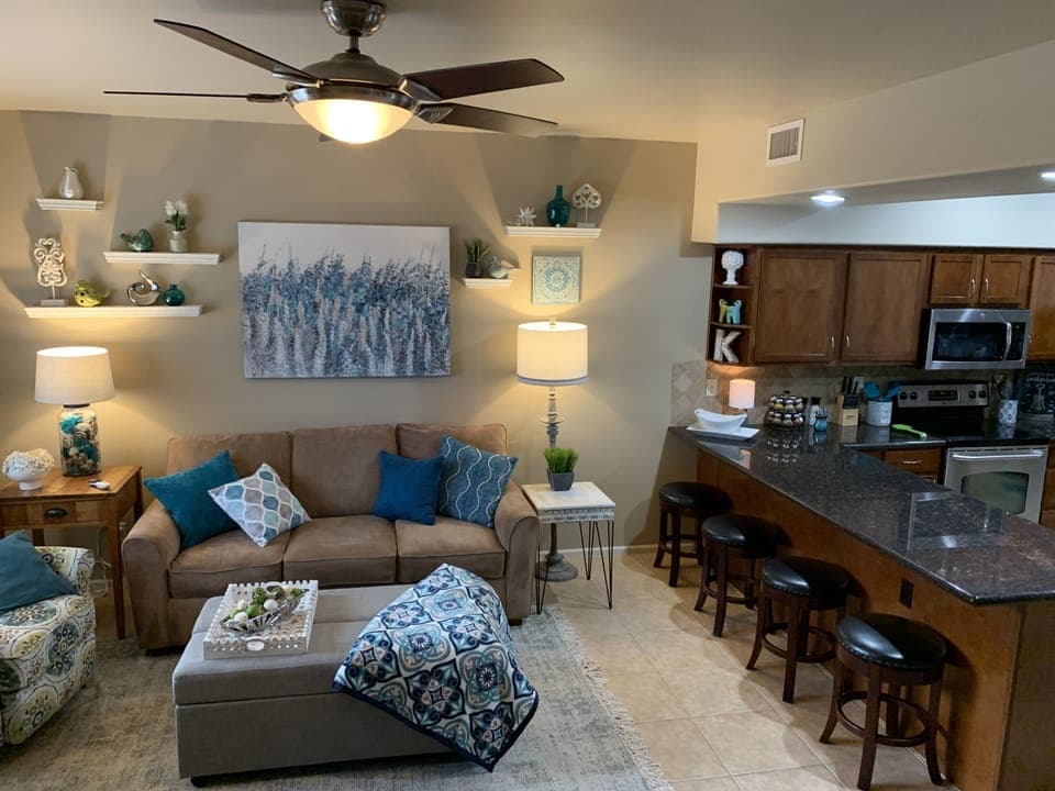 Spacious living room with queen sleeper sofa and twin sleeper coffee table.