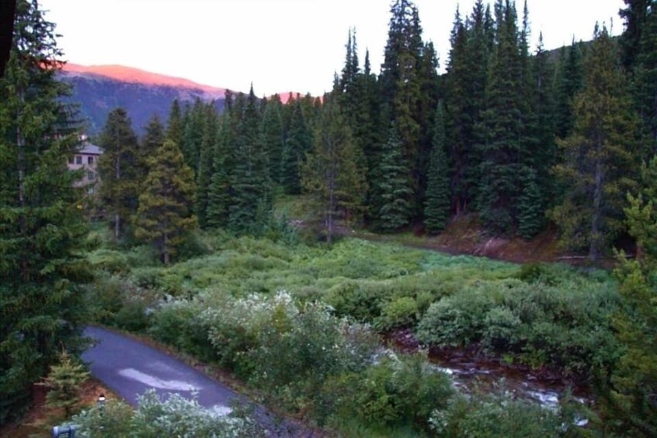 View of the bike path, creek and ski area from the third floor deck of townhome.