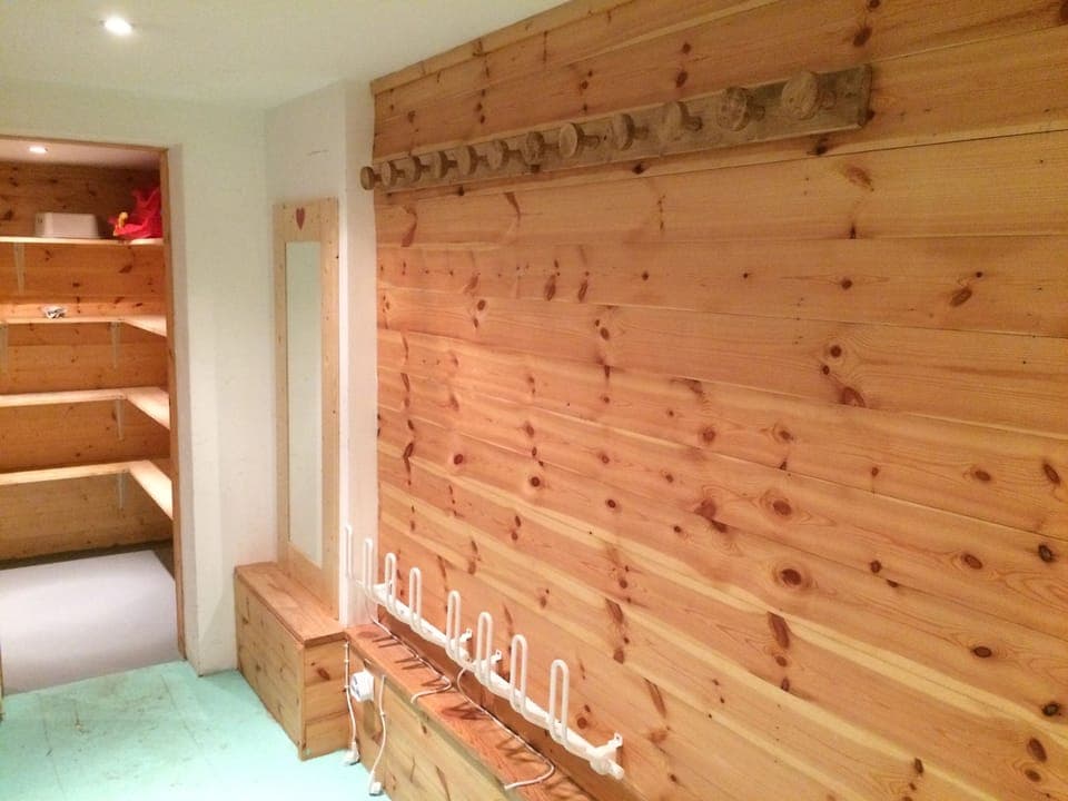 Ski Room with heated boot racks and hooks
