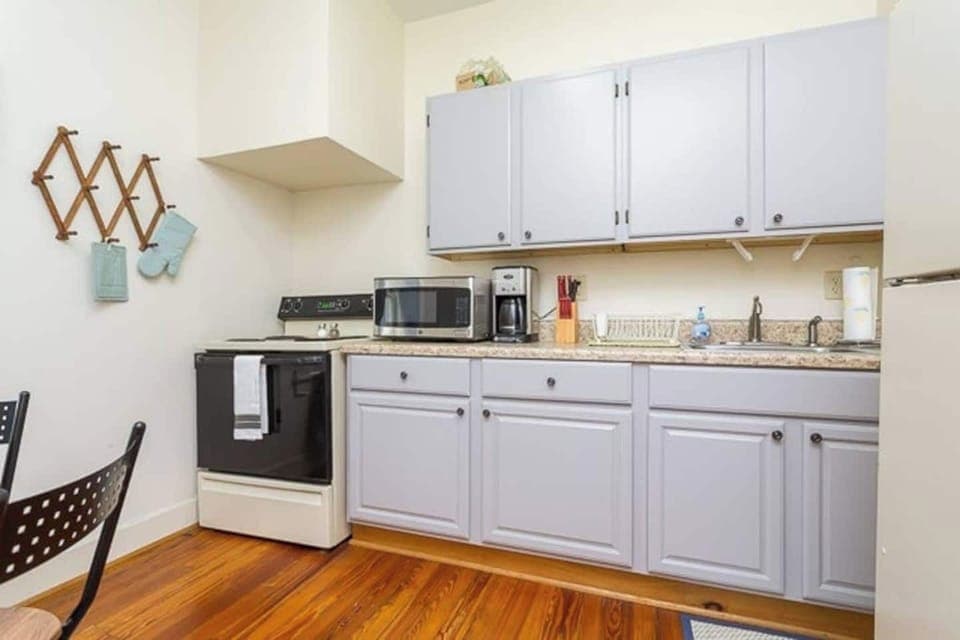 Full size kitchen with refrigerator, stove/oven and microwave