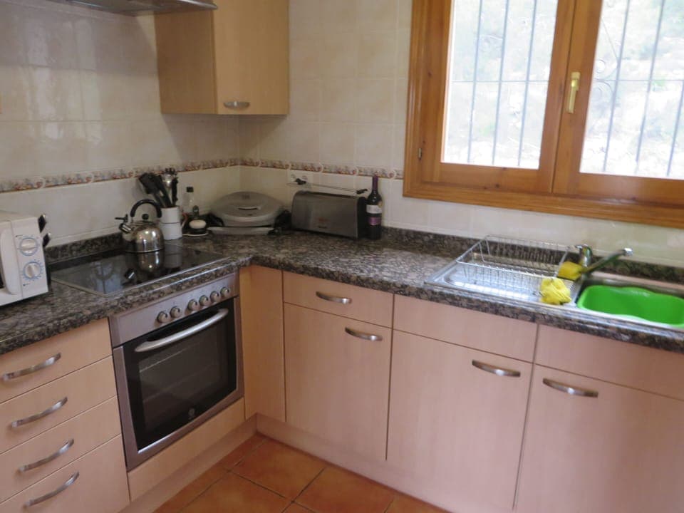 Kitchen with oven, microwave, Foreman grill.  An electric kettle was added 2016.