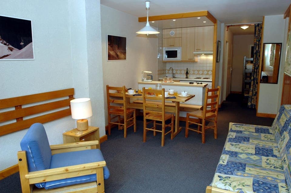 Prepare meals in the kitchenette and enjoy them at the dining table.