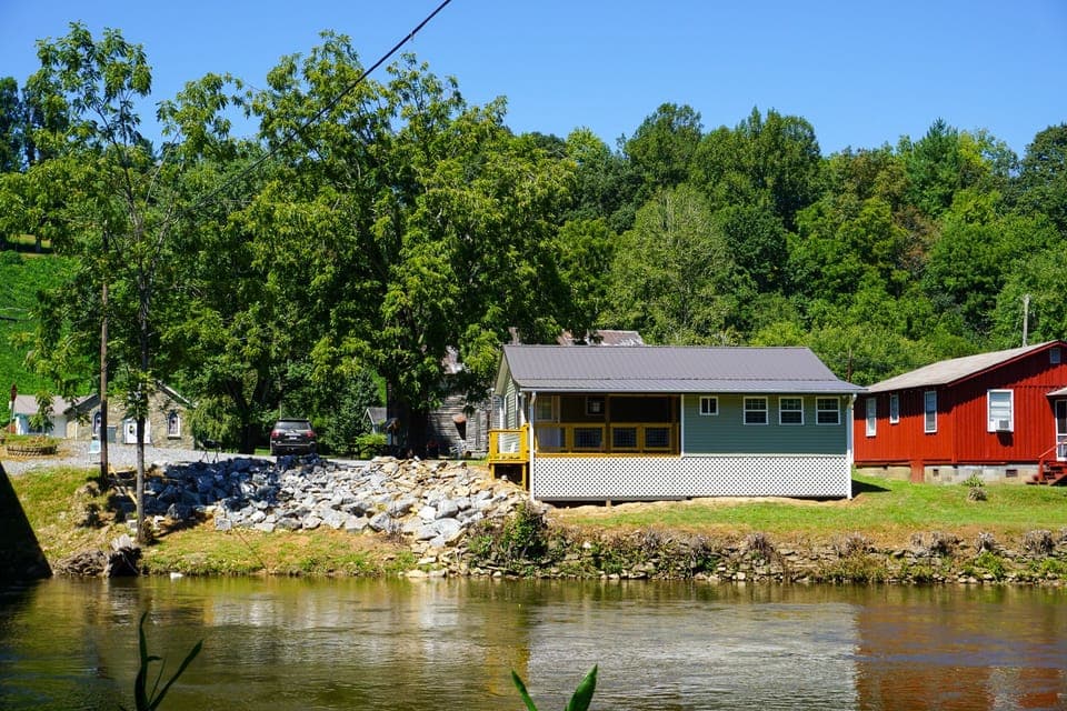 Exterior View - View of back of home and river in back yard.