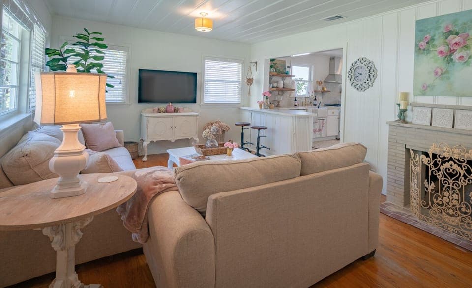 Living room and kitchen  are separated by a bar area