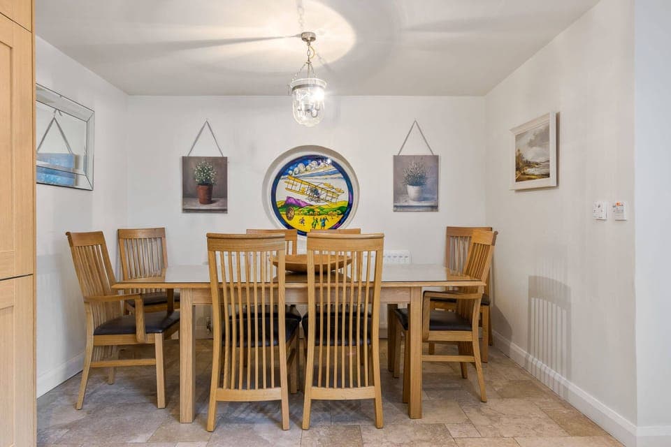 Kitchen has a dining area to one end which comfortably seats 8. 