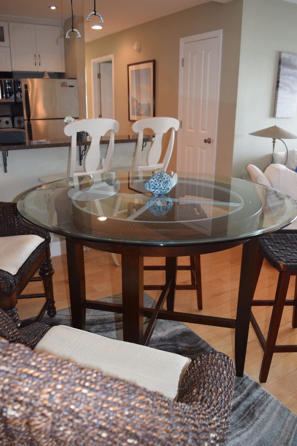 The dining table seats four with additional seating for 2 more at the bar. 