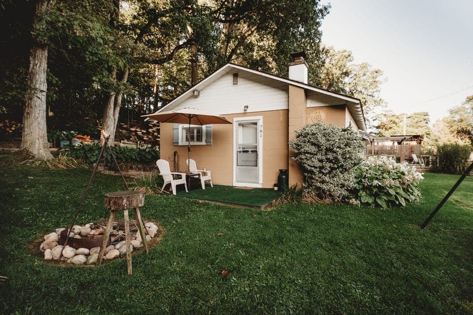 View of Cottage from Parking Area(Cottage has recently been painted Maroon)