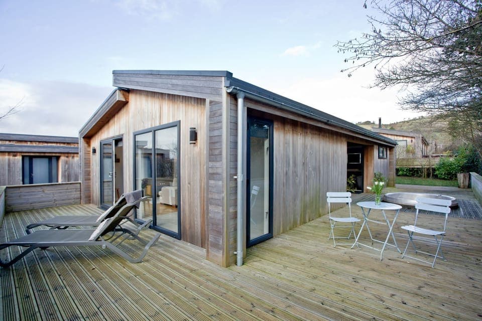 Lodge exterior with wrap around furnished decking and hot tub - Nyland Lodge, Strawberryfield Park