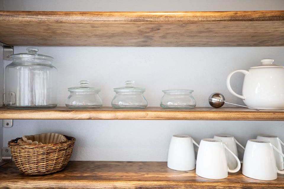 Contemporary open shelves, coffee service, spices; casual and comfortable.