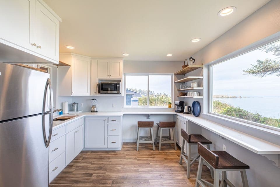 New kitchenette with coffee bar & seating looking at Cape Arago lighthouse.
