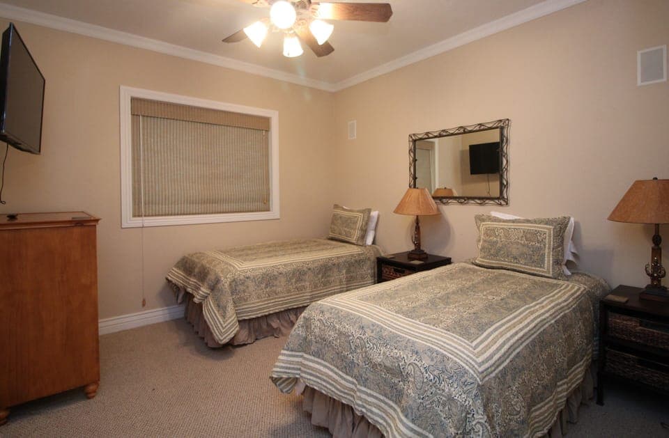 BEDROOM #5 WITH TWO TWIN BEDS AND FLAT SCREEN TV