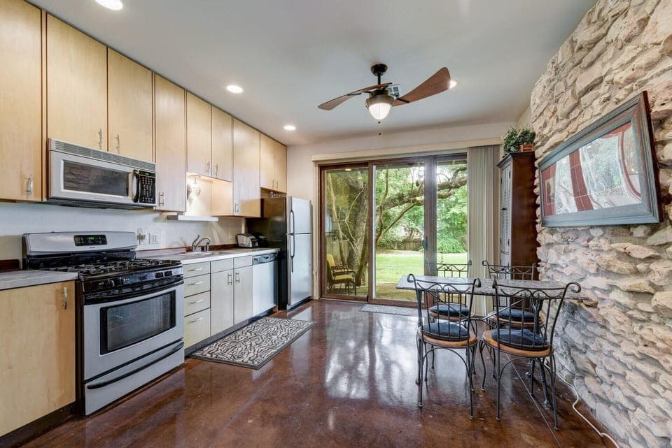 Full kitchen with dining area.